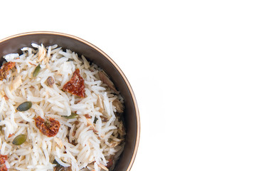 detail of basmati cold rice, delicious food with dry tomatoes, mackerel, pumpkin and flax seeds