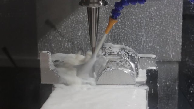 Tooling machined by CNC machining Center ; industrial manufacturing equipment background