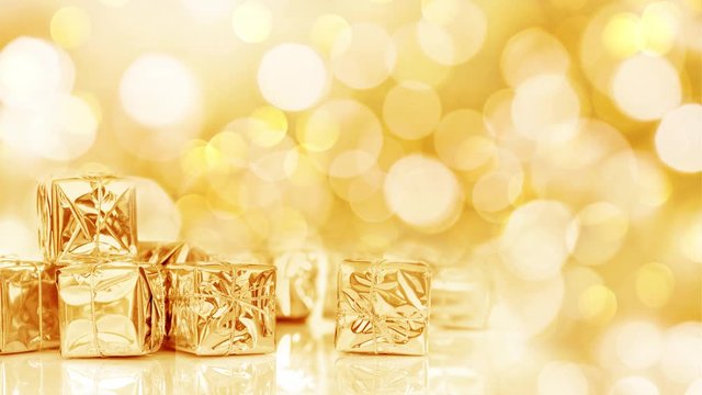 Seamless loop - small Christmas gifts in shiny golden paper, bokeh lights background, HD video