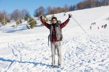 Male hiker on snow covered mountain