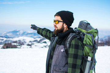 Man exploring the snow covered mountain
