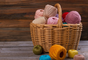 Fototapeta na wymiar Spools of yarn in basket