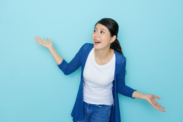 cheerful girl opening arms looking at empty area