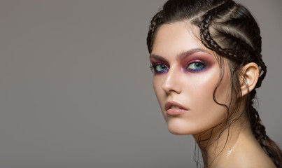 Fashion portrait of beautiful woman. Fantasy make-up and hairstyle.