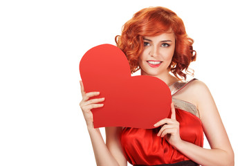 Portrait of smiling red hair woman holding big red heart. Isolated on white.