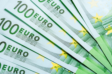 Heap of One hundred Euro currency banknotes.