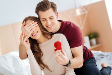 Romantic gentleman surprising his girlfriend with proposal