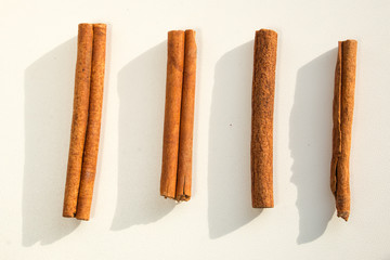 Cinnamon sticks on white background close macro