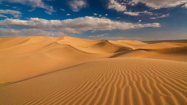 Sunset over the sand dunes in the desert