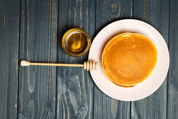 Tasty healthy breakfast - fresh pancakes with honey