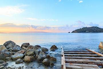 Wood trails into sea from small shipyard in Kargi beach, Datca, Turkey