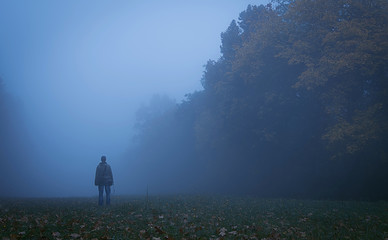 Tourist man in the nature a foggy day