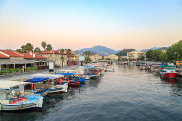 Fototapeta na wymiar Fisher boats in the canal to sea near marina area in Marmaris, Turkey
