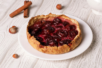 plum pie on a white plate