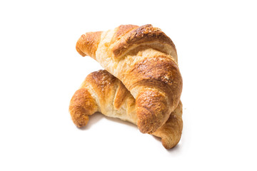 Due cornetti freschi su fondo bianco