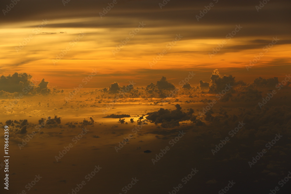 Wall mural sunset white cloud sky at high level attitude, view from window airplane