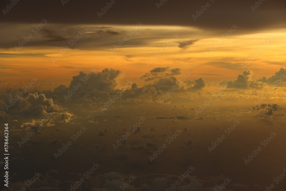 Wall mural sunset white cloud sky at high level attitude, view from window airplane
