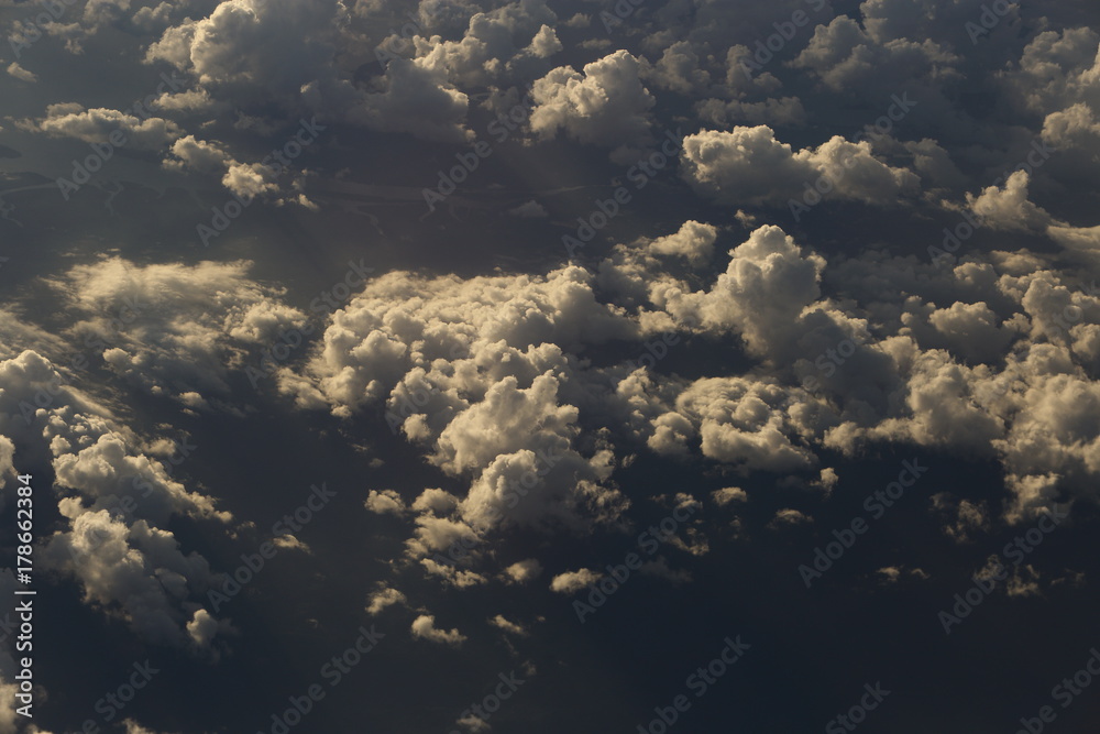 Wall mural sunset white cloud sky at high level attitude, view from window airplane