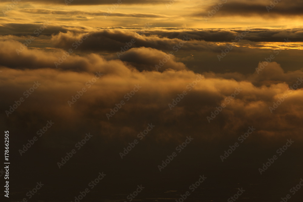 Wall mural sunset white cloud sky at high level attitude, view from window airplane