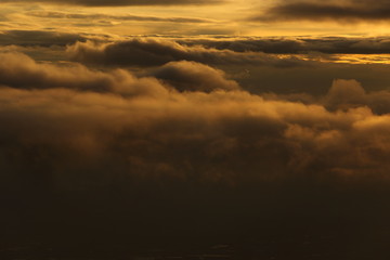 Sunset White Cloud sky at high level attitude, view from window airplane