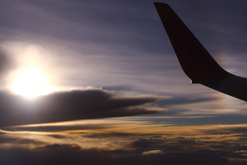 Obraz premium Sunset White Cloud sky at high level attitude, view from window airplane