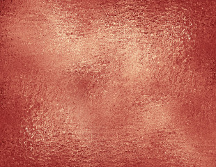 Rose gold foil textured background. Decorative metallic texture in trendy rose color, wrapping paper sample concept.