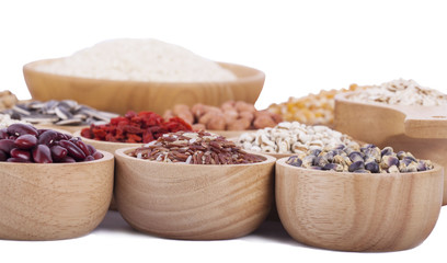Cereal grains , seeds, beans on wooden background