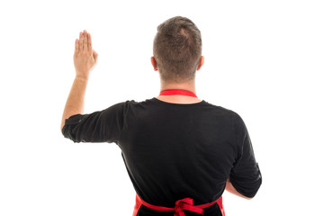 Back view of supermarket employer making oath gesture