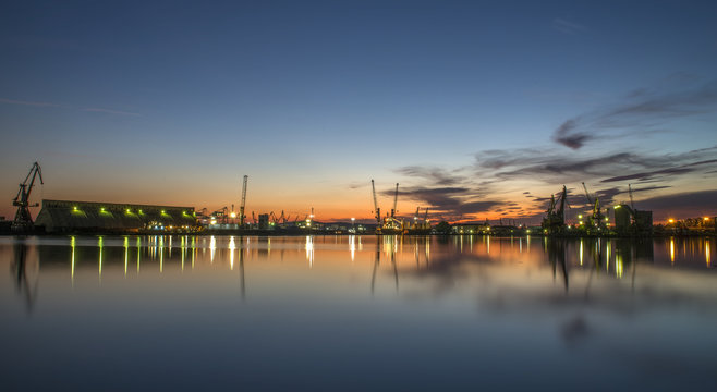 port on sunset with water reflections