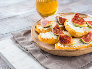 Crostini with cheese and figs. Light sweet and savory snack with wine