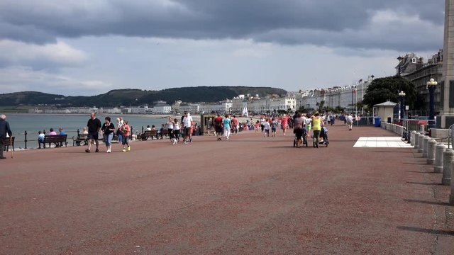 Llandudno, UK - August 8th, 2014. The promenade at the seaside resort of llandudno in wales promenade with visitors walking.

EDITORIAL
