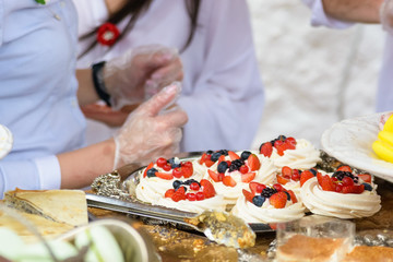 Close up meringue dessert with berries in shop