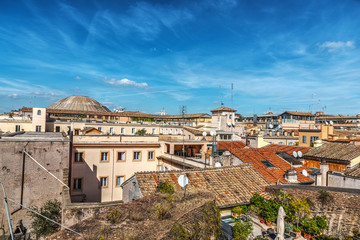 Fototapeta na wymiar Blue sky over old roofs in Rome