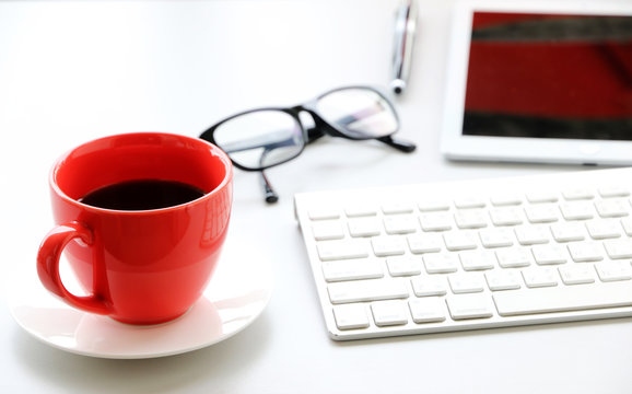 Red Coffee Cup On The Desk Business Workspace Background In Office Morning Work.business Concept