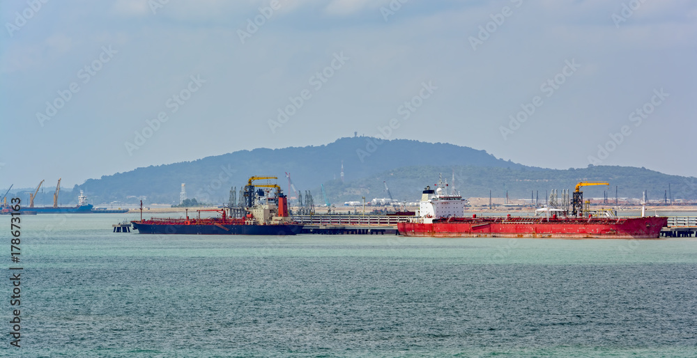 Poster pengerang deepwater petroleum terminal with tankers.