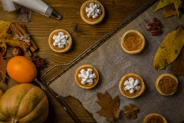 Thanksgiving concept - making mini pumpkin pies