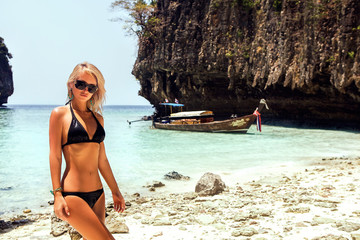 Obraz premium Beautiful woman relaxing on the beach. Thailand