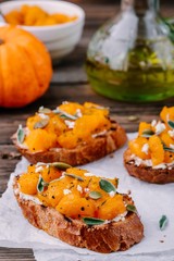 Pumpkin and goat cheese bruschetta with sage and pumpkin seeds