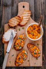 Pumpkin and goat cheese toasts with sage and pumpkin seeds