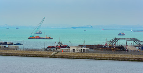 Transhipment sand from truck to barge.