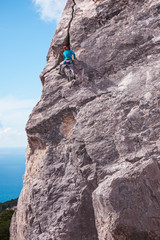A rock climber on a wall.