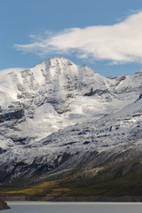 Fototapeta na wymiar beautiful view of the mountain peak with snow. Swiss Alps with a clean lake