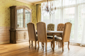 Table and chairs in classic interior