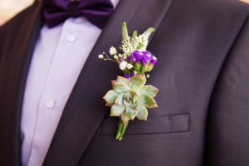 Wedding boutonniere on suit of groom