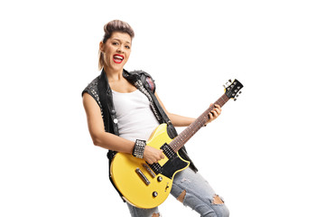 Female punker playing an electric guitar and singing