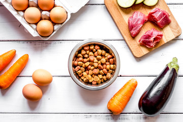 ingredients for pet food holistic top view on wooden background