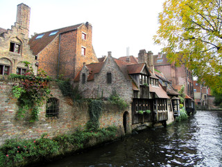 Fototapeta na wymiar View from the bridge.Medieval houses above the water. Bruges, Belgium