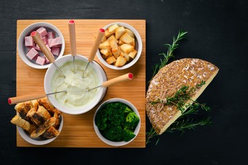 Cold snacks. Sausage, cheese, broccoli and salty sticks. Italian cuisine.On a wooden surface. Top view. Free space for your text.