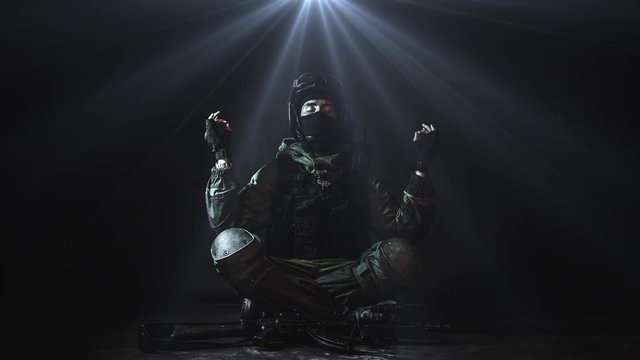 Cinemagraph. Meditating Soldier. Peace and harmony. Yoga.