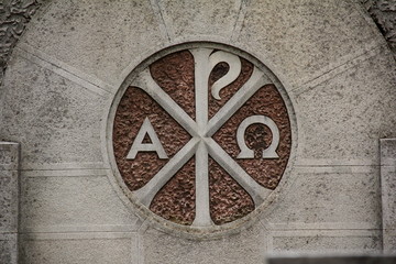 Obraz na płótnie Canvas Alpha and the Omega Sign in Bellu Cemetery